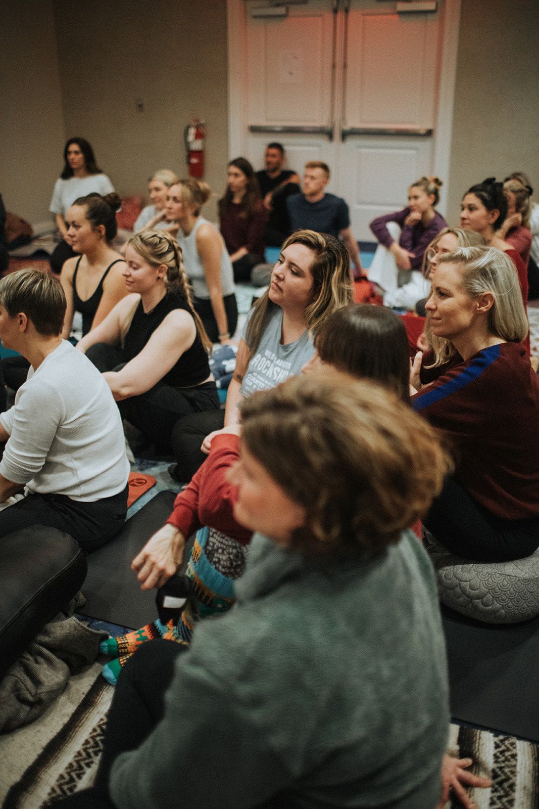 A crowd listening closely during a past gathering