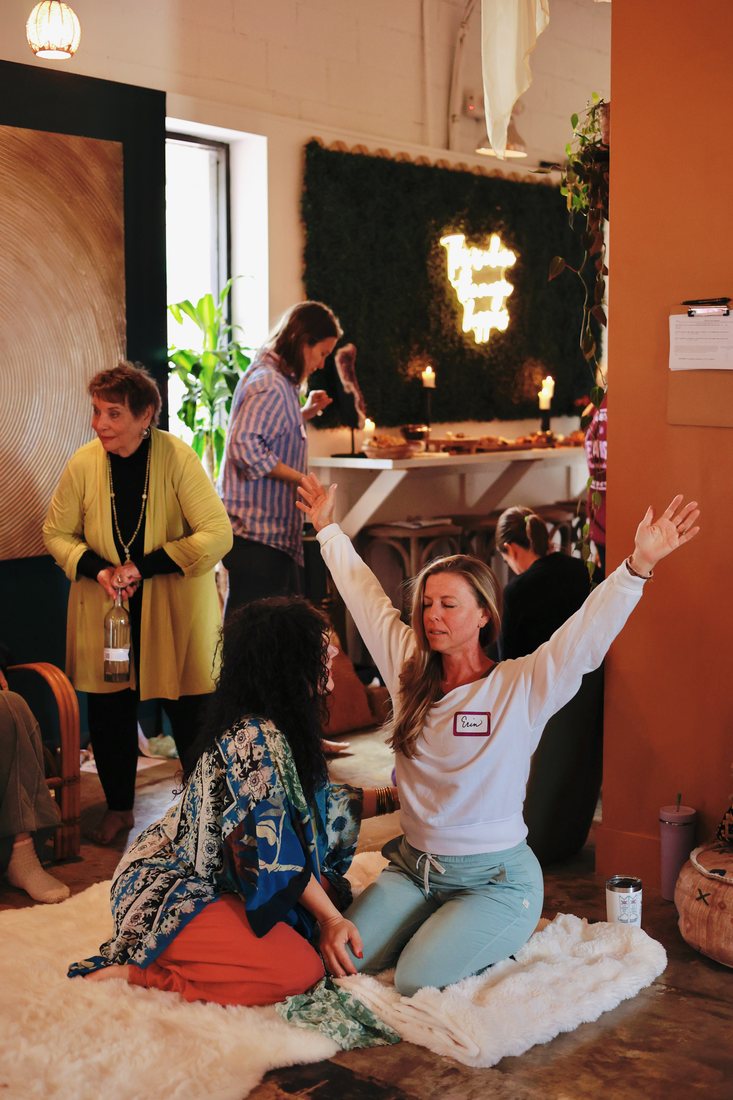 Group seated together in the IVY Energetic Studio space