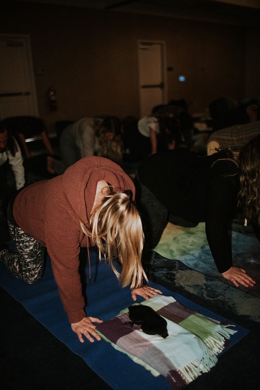 Group moving through a stretch pose together